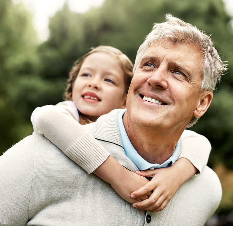 dad carrying daughter on back